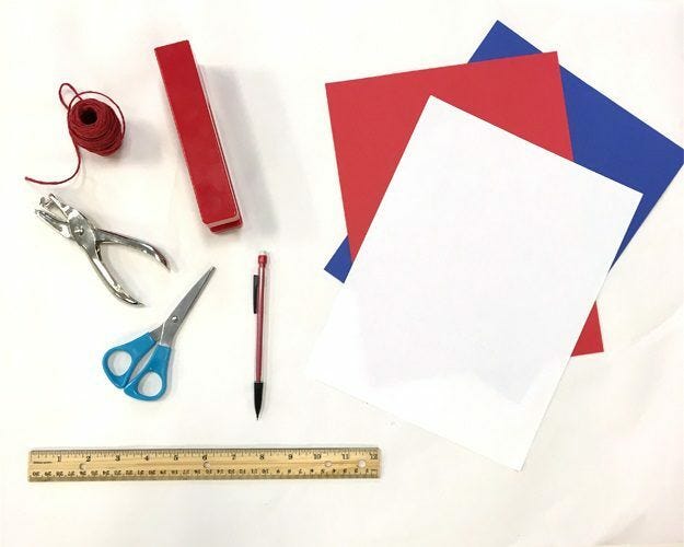 red paper, white paper, blue paper, ruler, string, stapler, tweezers